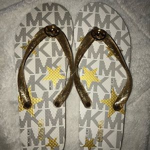 Michael Kors- gold glitter logo flip flops